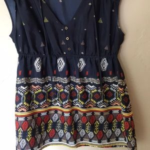 Navy blouse with tribal pattern.